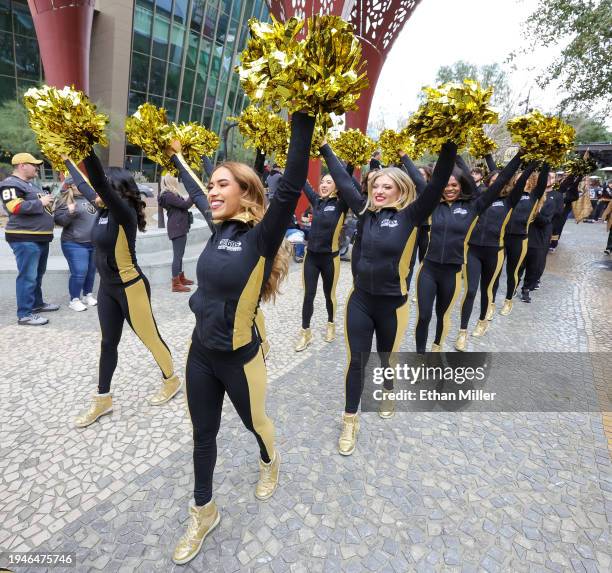 Members of the Vegas Golden Knights Vegas Vivas cheerleaders participate in The March to the Fortress at The Park before the Golden Knights' game...