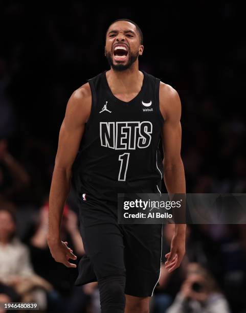 Mikal Bridges of the Brooklyn Nets celebrates a point against the Miami Heat during their game at Barclays Center on January 15, 2024 in New York...