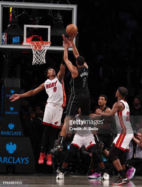 Mikal Bridges of the Brooklyn Nets shoots against Josh Richardson of the Miami Heat during their game at Barclays Center on January 15, 2024 in New...