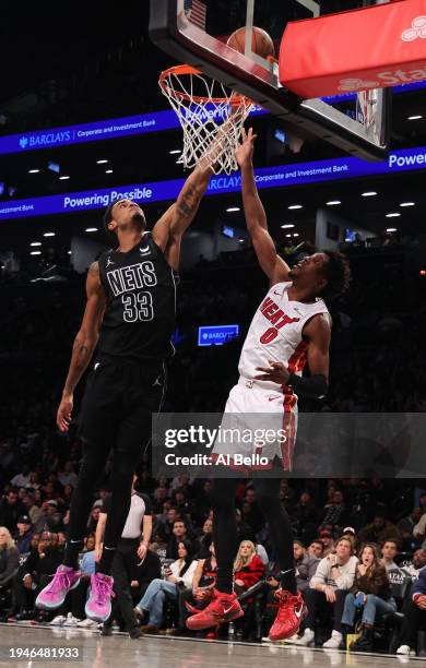 Nic Claxton of the Brooklyn Nets shoots against Josh Richardson of the Miami Heat during their game at Barclays Center on January 15, 2024 in New...