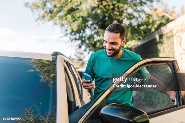 man driver getting into the car - new journey stock pictures, royalty-free photos & images