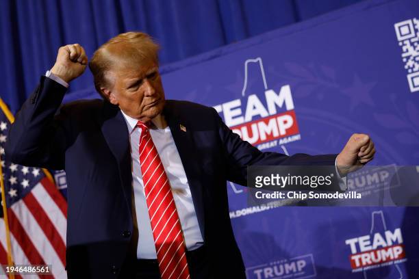 Republican presidential candidate and former President Donald Trump dances off stage at the end of a campaign rally at the Grappone Convention Center...
