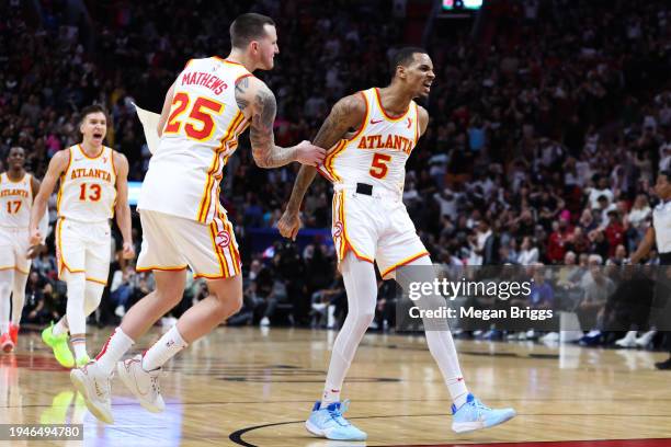 Dejounte Murray of the Atlanta Hawks reacts after making a basket against the Miami Heat during the fourth quarter of the game at Kaseya Center on...