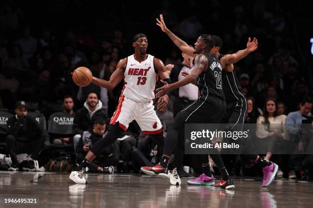 Bam Adebayo of the Miami Heat in action against Dorian Finney-Smith of the Brooklyn Nets during their game at Barclays Center on January 15, 2024 in...