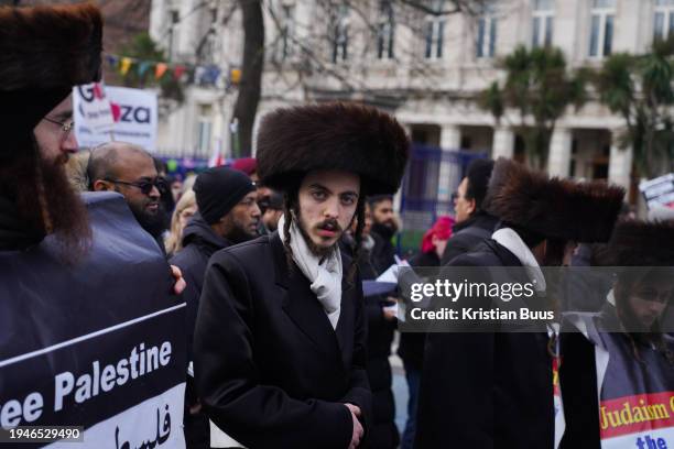 Members of the anti-Zionist Haredi Jewish group Neturei Karta show their support for Palestine as hundreds of protesters gathered in Whitechapel for...