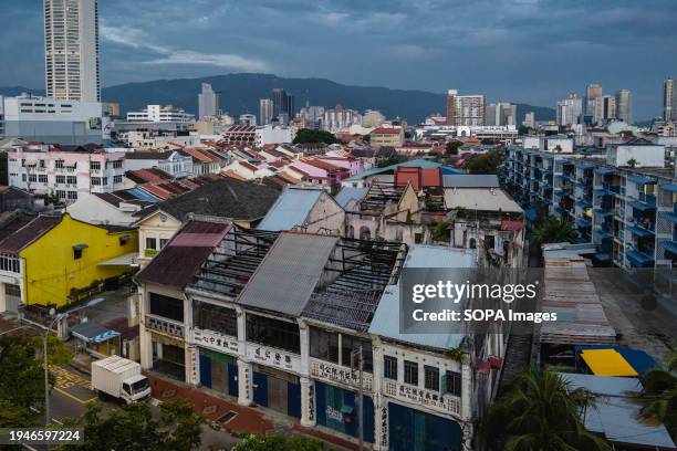 Cityscape view at sunrise showing the various types of building in George Town City, Penang Island. George Town, the capital of the Malaysian island...