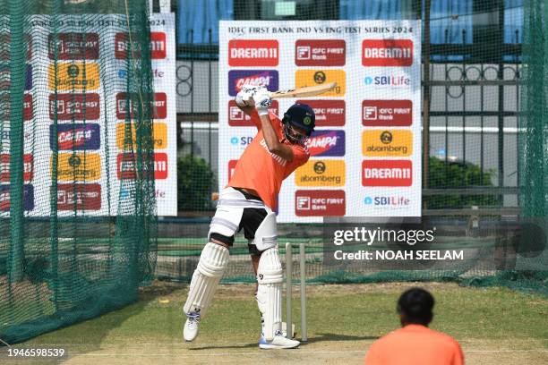 India's Axer Patel bats at the nets during a practice session at the Rajiv Gandhi International Cricket Stadium in Hyderabad on January 23 ahead of...