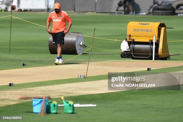 India's captain Rohit Sharma inspects the pitch during a practice session at the Rajiv Gandhi International Cricket Stadium in Hyderabad on January...