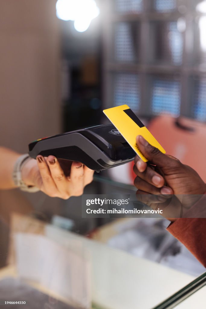 Close up of hands, contactless payment with a card