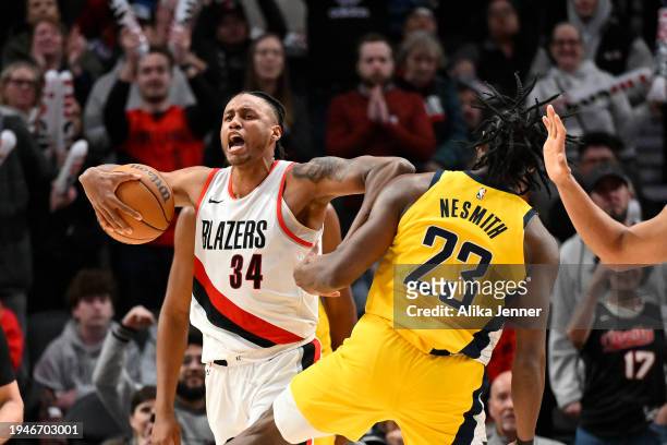 Jabari Walker of the Portland Trail Blazers elbows Aaron Nesmith of the Indiana Pacers during the fourth quarter of the game at the Moda Center on...