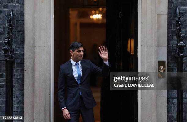 Britain's Prime Minister Rishi Sunak waves as he exits 10 Downing Street in central London on January 23 before greeting Belgium's Prime Minister...