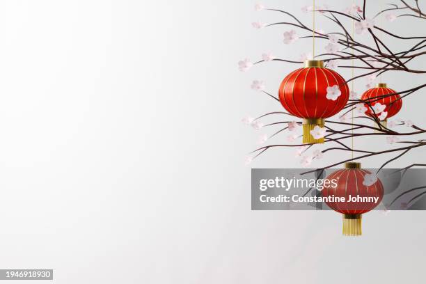 chinese new year red lanterns with blossoming branches - linterna china fotografías e imágenes de stock
