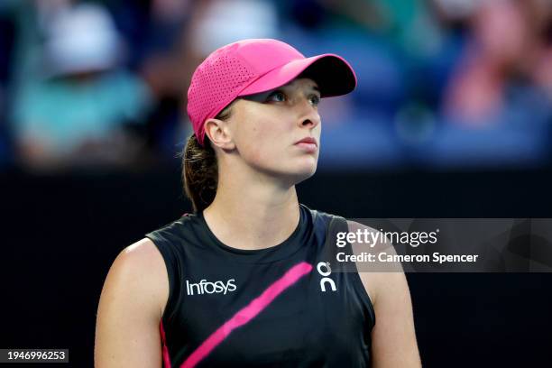 Iga Swiatek of Poland looks on in their round three singles match against Linda Noskova of the Czech Republic during the 2024 Australian Open at...