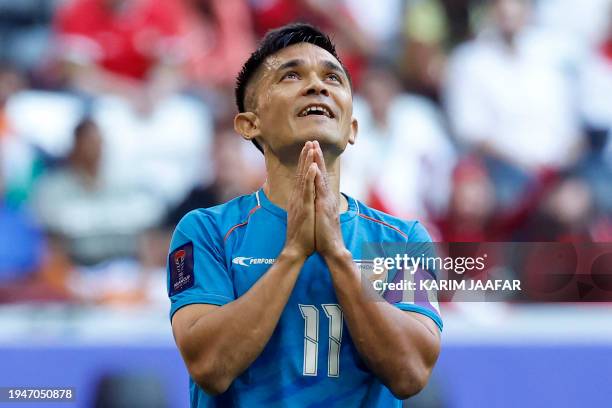 India's forward Sunil Chhetri reacts during the Qatar 2023 AFC Asian Cup Group B football match between Syria and India at Al-Bayt Stadium in...