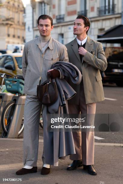 Scott Staniland wears beige turtleneck top, beige checked jacket with matching trousers, brown flat shoes, and Twins Brett Staniland wears white...