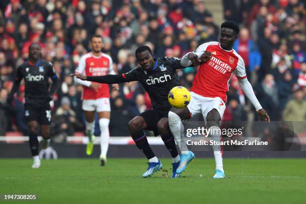 Tyrick Mitchell of Crystal Palace battles for possession with Bukayo Saka of Arsenal during the Premier League match between Arsenal FC and Crystal...