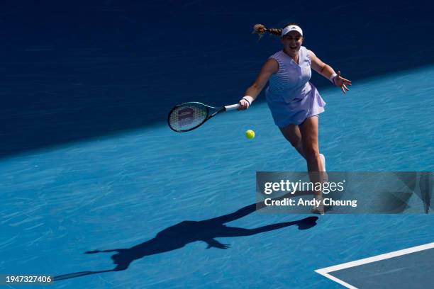 Jelena Ostapenko of Latvia plays a forehand in her round three singles match against Victoria Azarenka during day seven of the 2024 Australian Open...