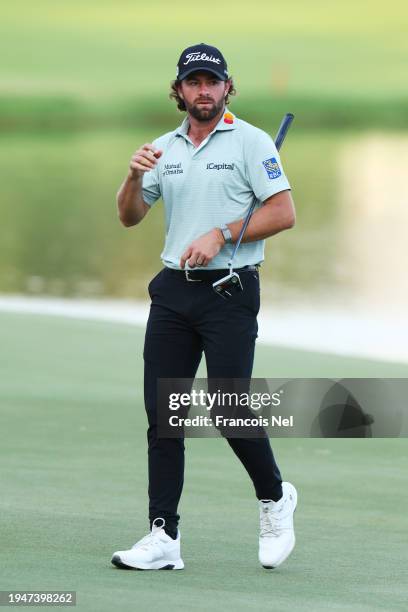 Cameron Young of the United States acknowledges the crowd on the 18th green during Round Three of the Hero Dubai Desert Classic at Emirates Golf Club...