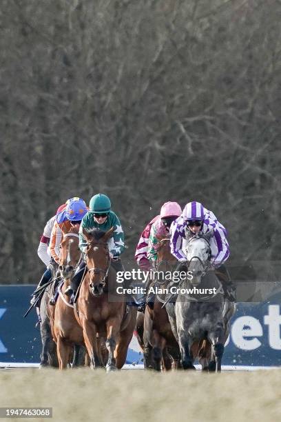 Runners make their way down the side of the track during The Boost Your Acca-Fenwa With BetUK Handicap at Lingfield Park Racecourse on January 20,...