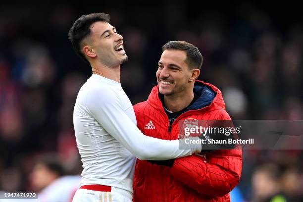 Gabriel Martinelli of Arsenal celebrates with teammate Cedric Soares following the team's victory during the Premier League match between Arsenal FC...