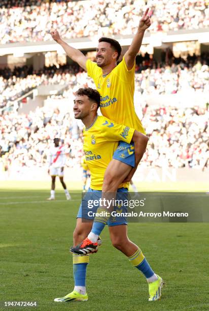 Javi Munoz of UD Las Palmas celebrates scoring his team's second goal with teammate Munir El Haddadi during the LaLiga EA Sports match between Rayo...