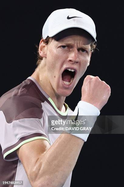 Italy's Jannik Sinner celebrates his second set win against Russia's Andrey Rublev during their men's singles quarter-final match on day 10 of the...