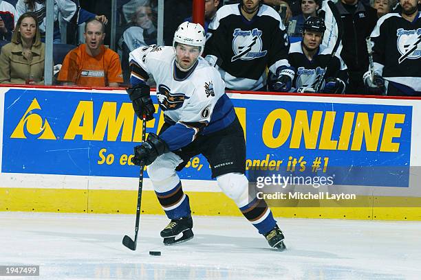Jaromir Jagr of the Washington Capitals plays the puck against the Tampa Bay Lightning in game six of the first round of the 2003 Eastern Conference...