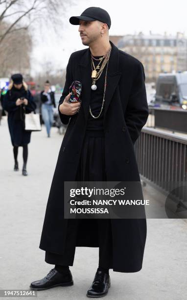 Guest arrives to attend the Chanel Women's Haute-Couture Spring/Summer 2024 Fashion Week in Paris on January 23, 2024. / "The erroneous mention[s]...