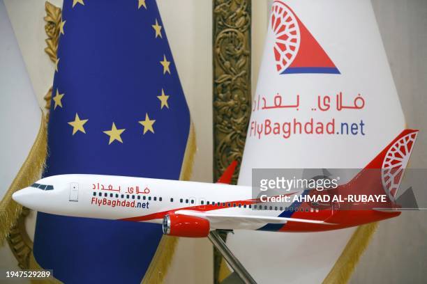 Photograph taken on January 23, 2024 shows an aircraft model displayed at a sales office of Iraqi airline Fly Baghdad in the Iraqi capital's Jadriya...
