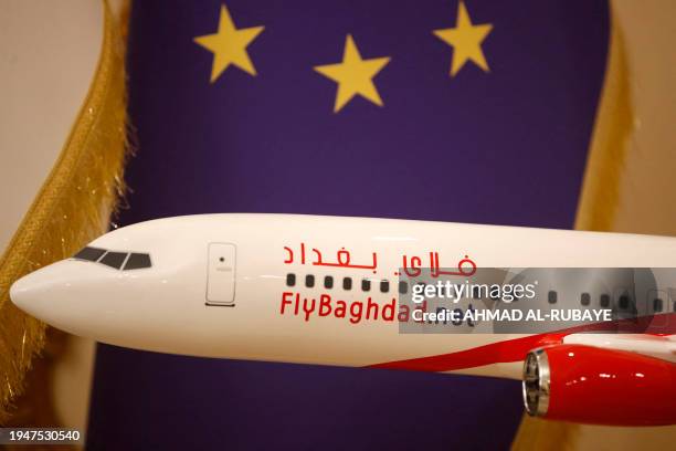 Photograph taken on January 23, 2024 shows an aircraft model displayed at a sales office of Iraqi airline Fly Baghdad in the Iraqi capital's Jadriya...