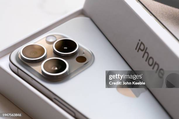 In this photo illustration a brand new Apple iPhone 15 pro titanium is displayed with box and packaging on January 20, 2024 in Leigh, United Kingdom.