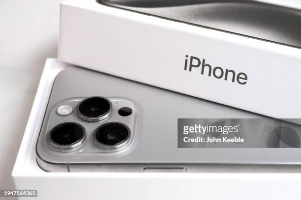 In this photo illustration a brand new Apple iPhone 15 pro titanium is displayed with box and packaging on January 20, 2024 in Leigh, United Kingdom.