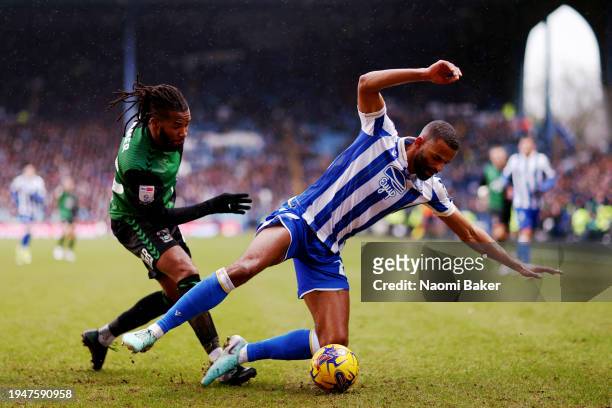 Michael Ihiekwe of Sheffield Wednesday is challenged by Kasey Palmer of Coventry City during the Sky Bet Championship match between Sheffield...