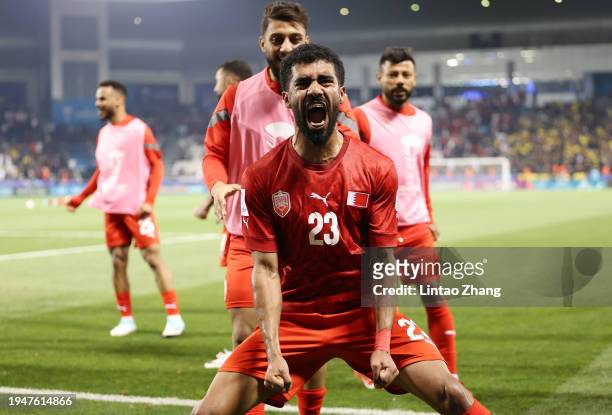 Abdullah Al-Khalasi of Bahrain celebrates following the team's victory during the AFC Asian Cup Group E match between Bahrain and Malaysia at Jassim...