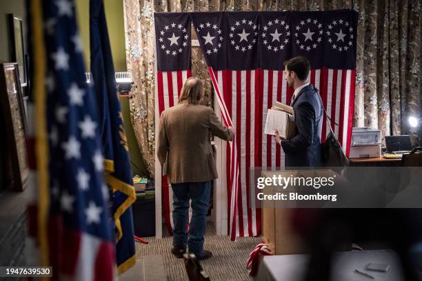 Tom Tillotson, town moderator, left, prepares before the first-in-the-nation midnight vote at the Tillotson House at The Balsams Resort in Dixville...