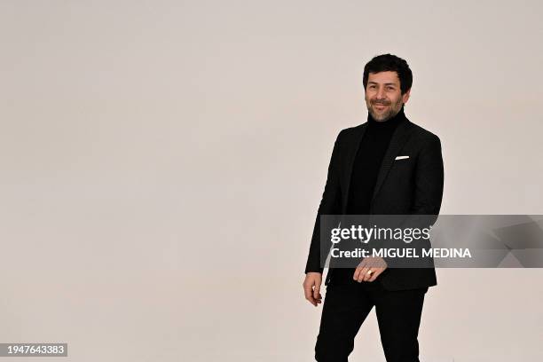 French fashion designer Alexis Mabille acknowledges the audience at the end of his Women's Haute-Couture Spring/Summer 2024 Fashion Week in Paris on...