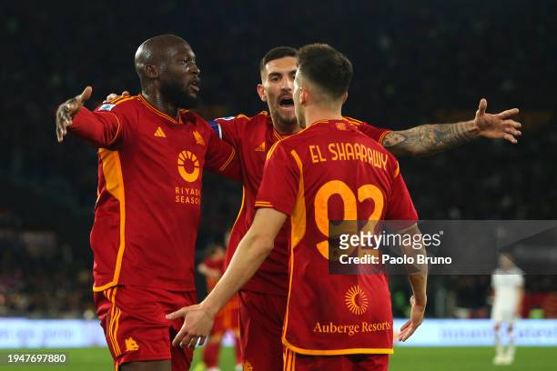 Romelu Lukaku of AS Roma celebrates with teammates Lorenzo Pellegrini and Stephan El Shaarawy after scoring his team's first goal during the Serie A...