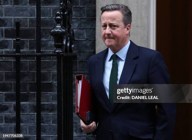 Britain's Foreign Secretary David Cameron leaves from 10 Downing Street in central London on January 23 after attending a weekly Cabinet meeting.