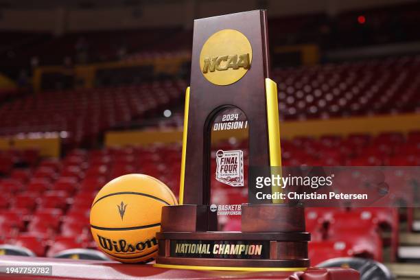 The NCAA men's basketball championship trophy is displayed before the game between the Arizona State Sun Devils and the USC Trojans at Desert...