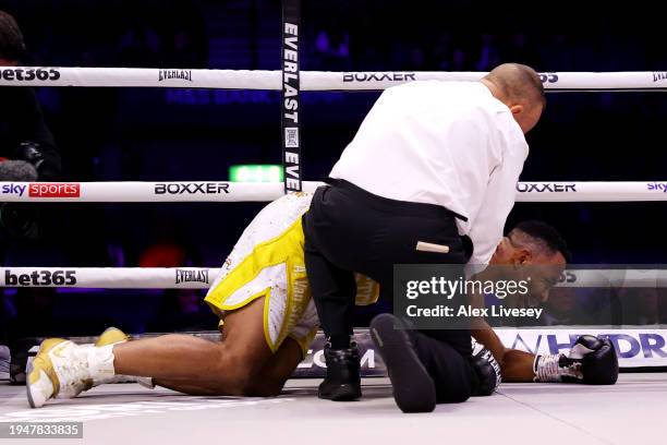 Steve Eloundou Ntere is checked on by the Referee after being knocked out by Jack Massey during the Cruiserweight between Jack Massey and Steve...