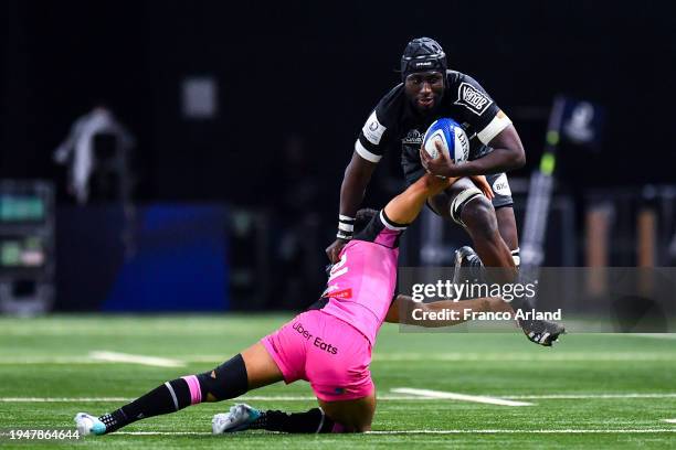 Ibrahim Diallo of Racing 92 is tackled by Ben Thomas of Cardiff Rugby during the Investec Champions Cup match between Racing 92 and Cardiff Rugby at...