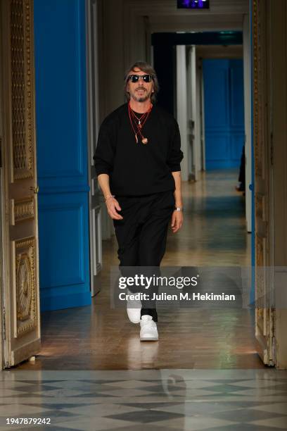 Designer Pierpaolo Piccioli walks the runway after the Valentino Menswear Fall/Winter 2024-2025 show as part of Paris Fashion Week on January 20,...