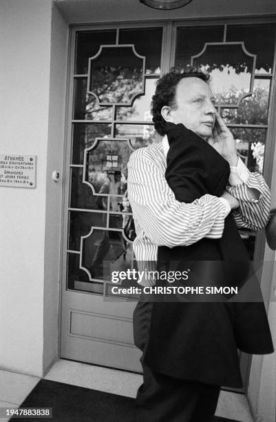 Portrait taken on June 20, 1986 shows French producer Paul Lederman attending to release the body of French comic Coluche. Coluche died on 19 June...