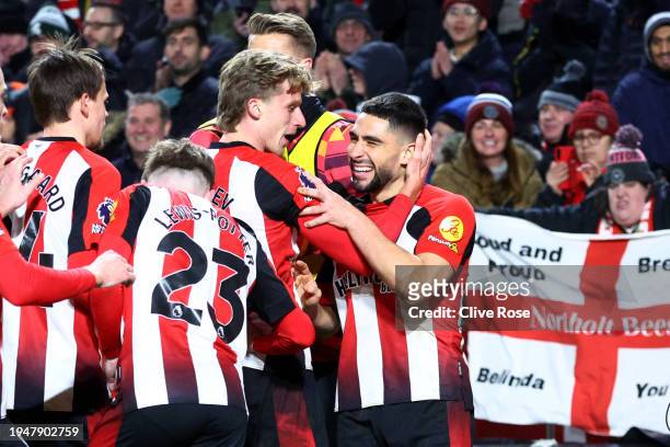 Neal Maupay of Brentford celebrates scoring his team's third goal with teammates during the Premier League match between Brentford FC and Nottingham...