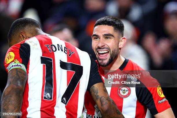 Neal Maupay of Brentford celebrates scoring his team's third goal with teammate Ivan Toney during the Premier League match between Brentford FC and...