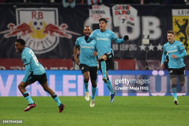 Piero Hincapie of Bayer Leverkusen celebrates scoring his team's third goal with teammates during the Bundesliga match between RB Leipzig and Bayer...