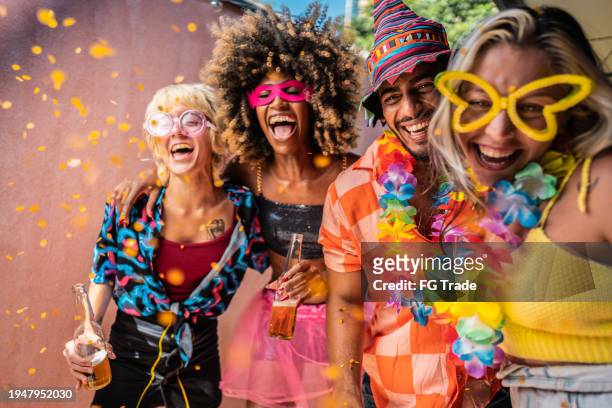 friends enjoying carnival at home - carnival celebration event stock pictures, royalty-free photos & images
