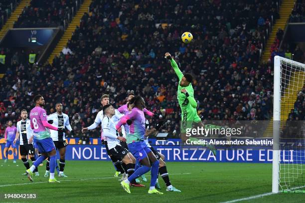 Maduka Okoye of Udinese Calcio makes a save during the Serie A TIM match between Udinese Calcio and AC Milan at Dacia Arena on January 20, 2024 in...