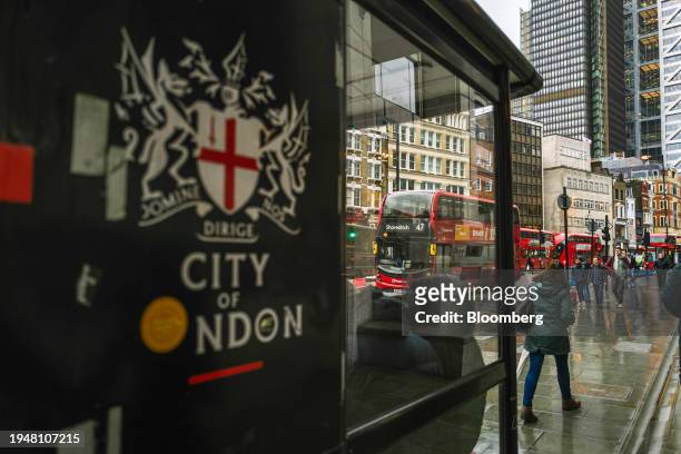 The City of London coat of arms on a bus stop near Liverpool Street railway station in London, UK, on Tuesday, Jan. 23, 2024. A quiet revolution...