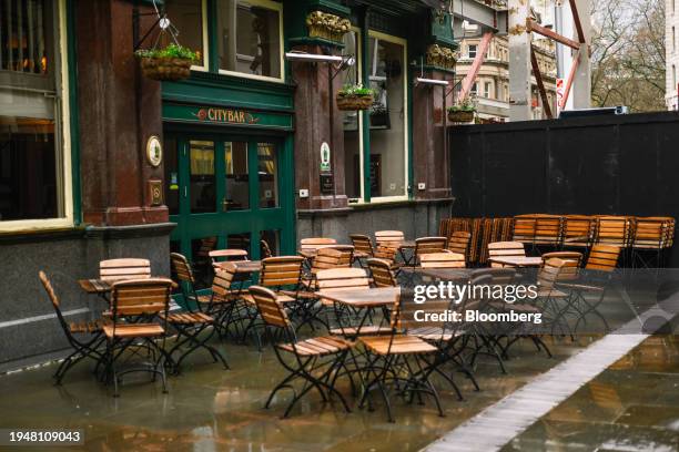 Empty tables outside a pub in the City of London, UK, on Tuesday, Jan. 23, 2024. A quiet revolution in the financial district will rip out roadways...